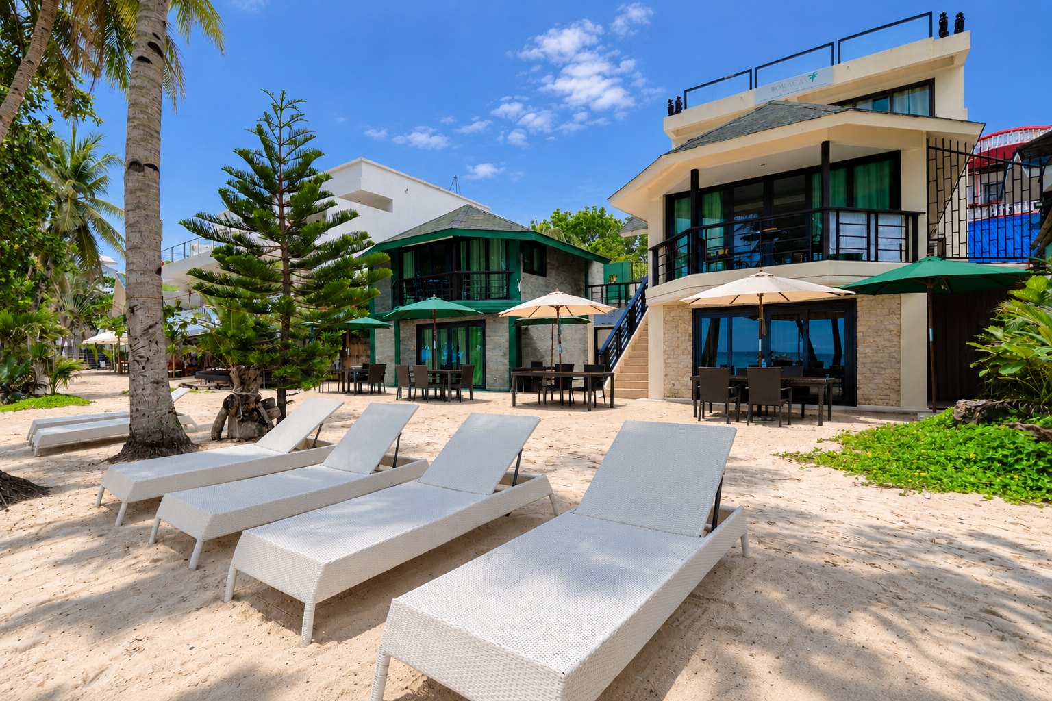 Boracay Beach Houses on the beachfront with white sun loungers