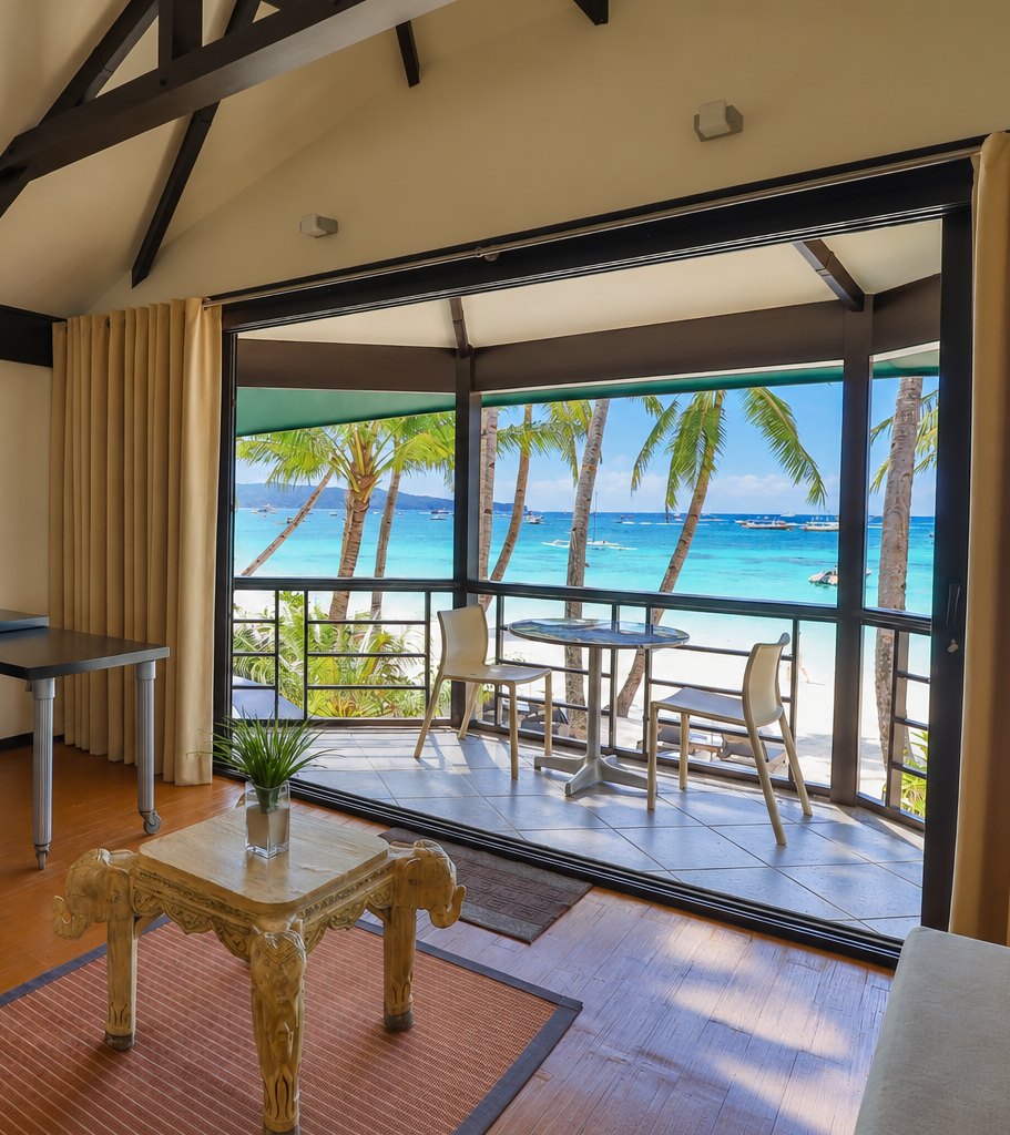 Room veranda opening onto White Beach